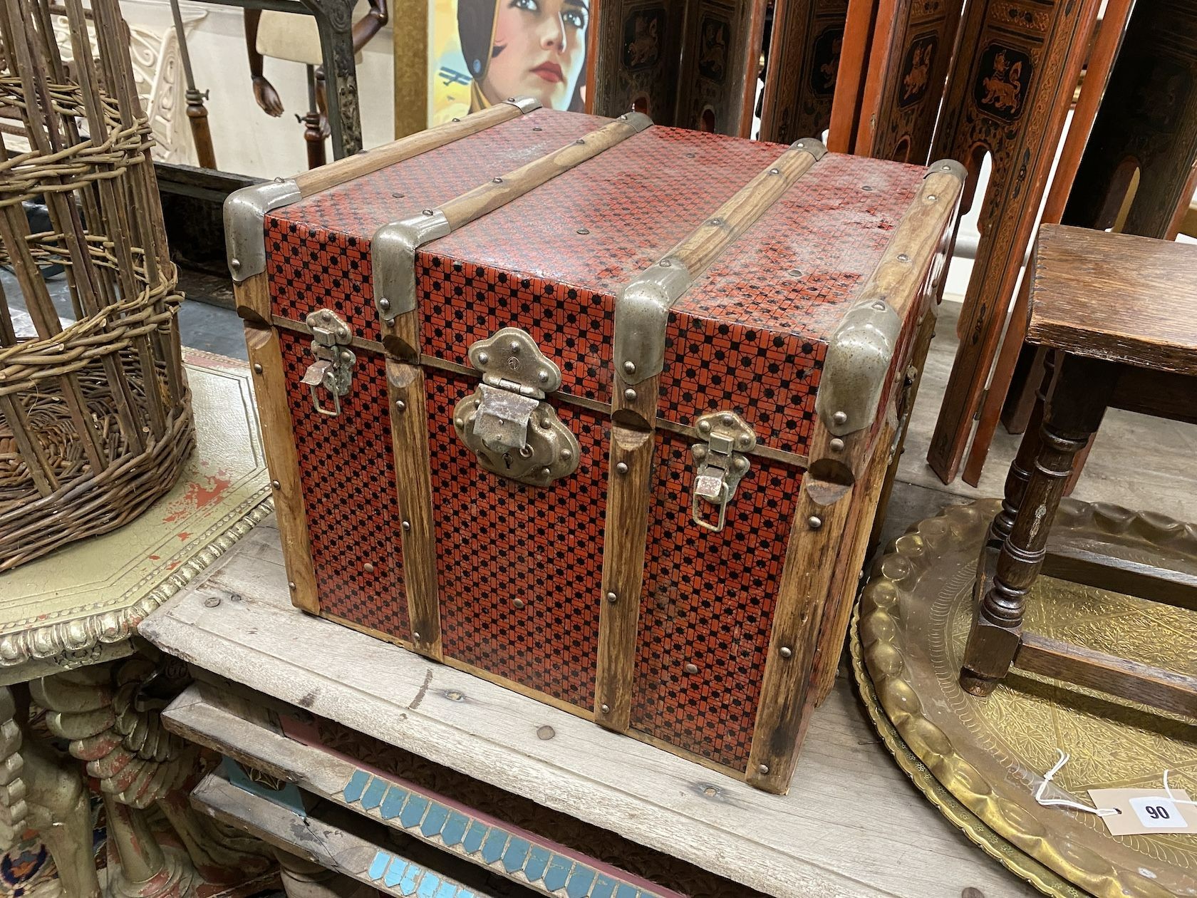 A Chinese lacquer eight fold table screen, height 67cm, an oak stool, and two engraved brass trays and a travelling trunk